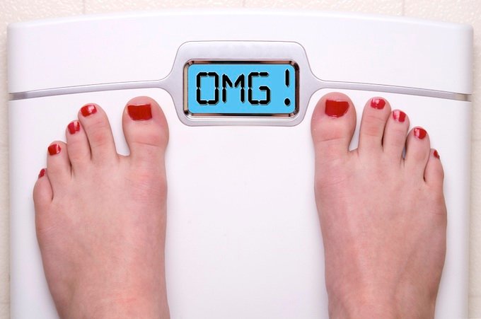 Digital Bathroom Scale Displaying OMG Message