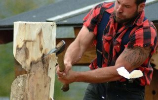 strong lumberjack chopping the wood